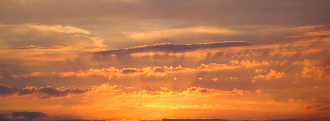 Golden Sunset - Clouds with a gold and silver lining at sundown in Salcombe, Devon. The sky is on fire.