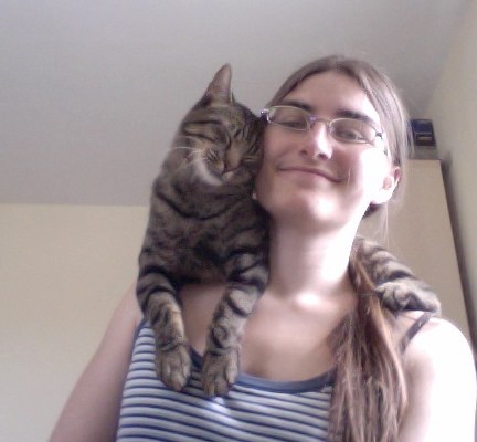 My cat pretending to be a scarf.